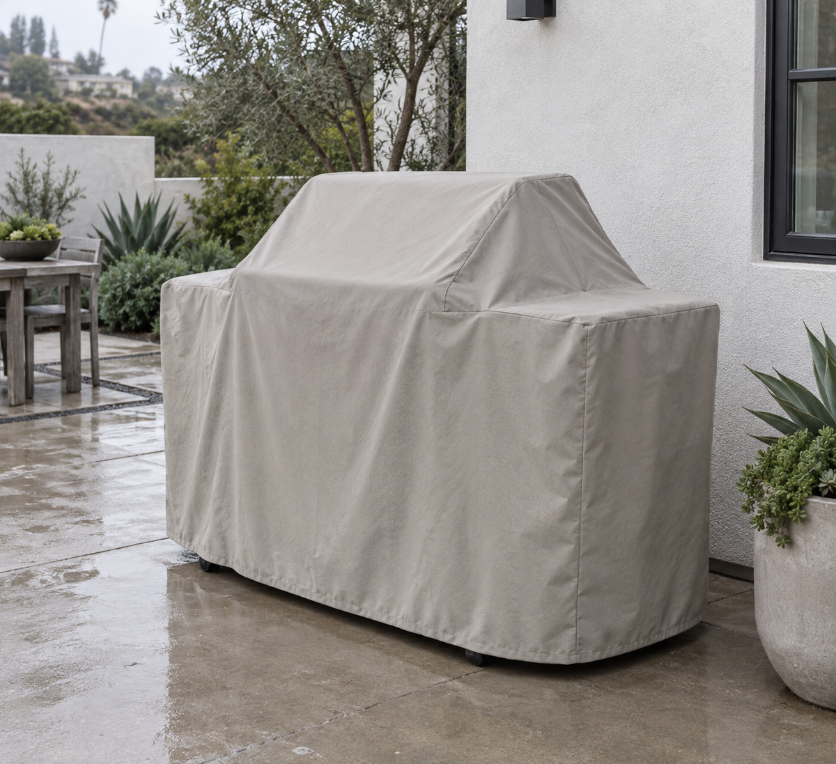 Oyster example of a fitted cart-grill cover in an overcast courtyard
