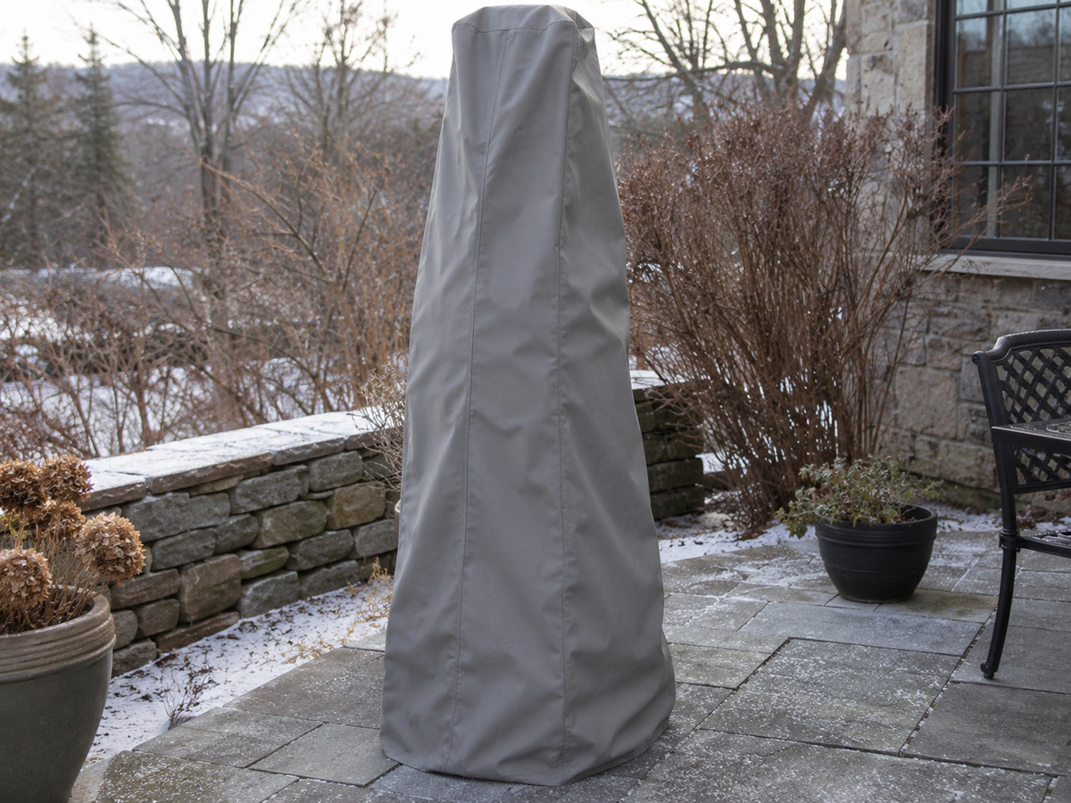 Gray custom cover over an outdoor fountain on a winter patio